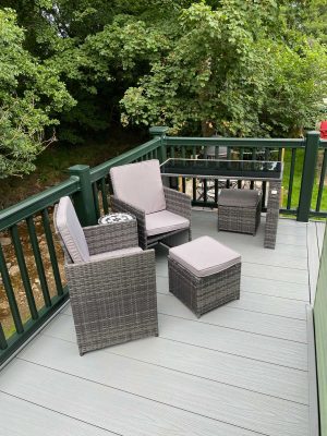 pod dining chairs on grey decking by the river in nidderdale