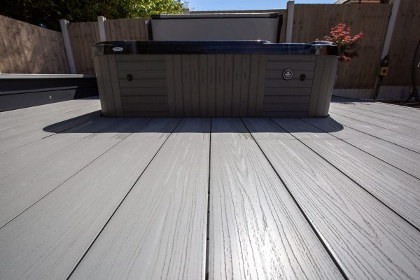 Light grey decking around a hottub