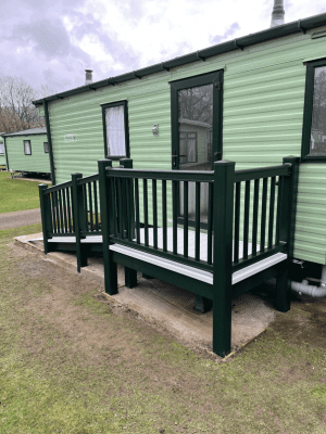 Angle view of wheelchair ramp and decking for caravan