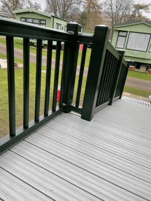 Looking down wheelchair ramp dark green deck